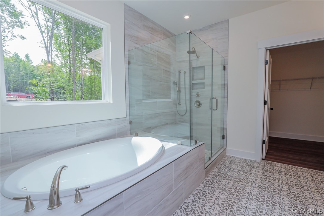 Photo represents the plan, not the actual home. Design selections may vary. Primary suite w/ luxury primary shower, separate vanities and window package.