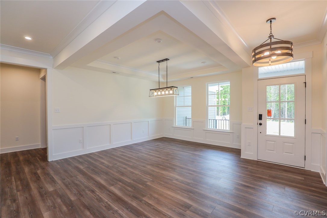 Photo represents the plan, not the actual home. Design selections may vary. Foyer w/ tray ceiling and EVP floors.