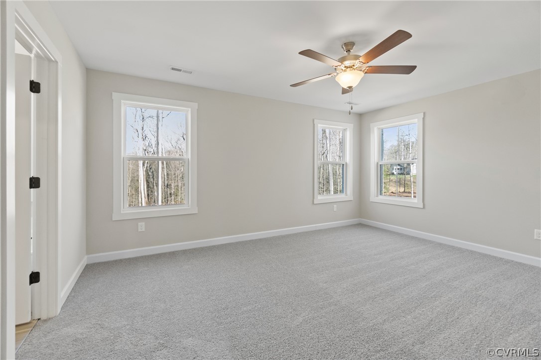 Unfurnished room with light carpet and ceiling fan