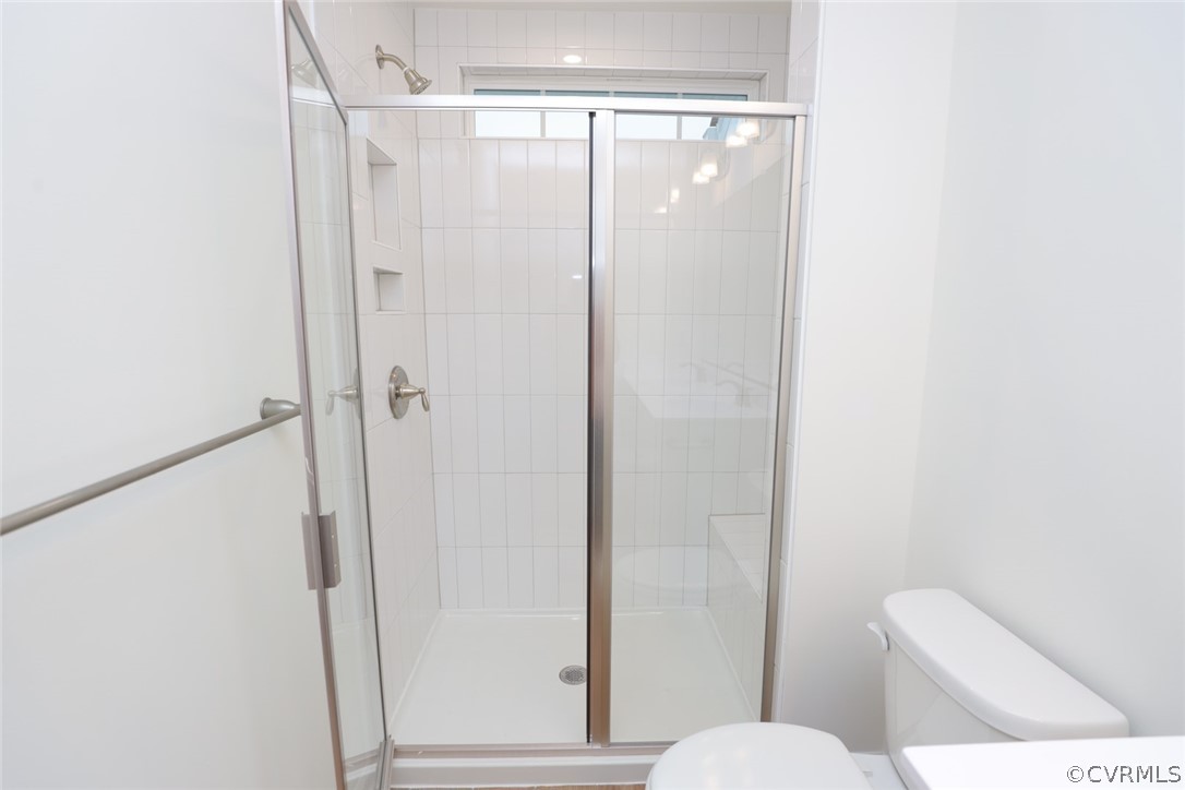 Upstairs you'll find the private primary suite featuring an ensuite bath with tiled shower and walk-in closet.
