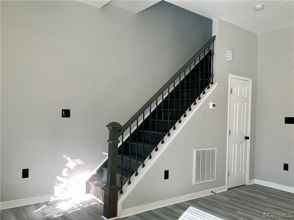 Stairs with a towering ceiling Going to 2nd where the Master Bedroom Exist All Alone