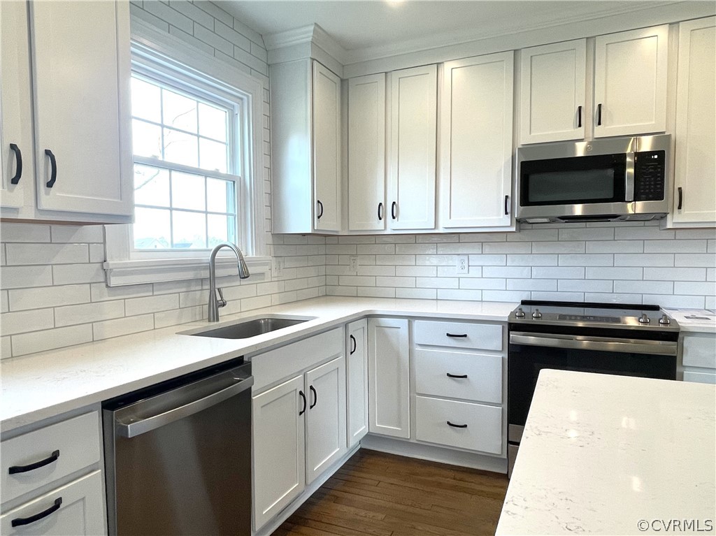 Stainless GE appliances, soft-close cabinetry