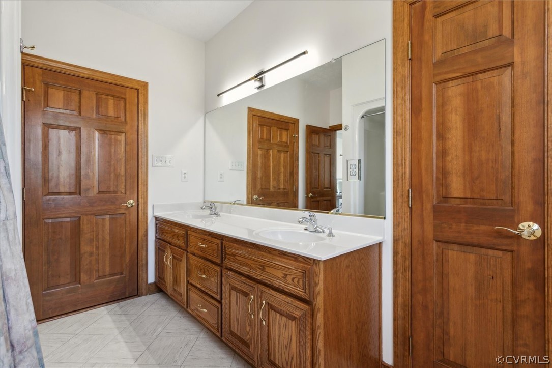 Hall Bath - Custom Cabinetry to match entire house, double door linen closet, Tub/Shower, New Lighting, Direct Access to 2nd Bedroom