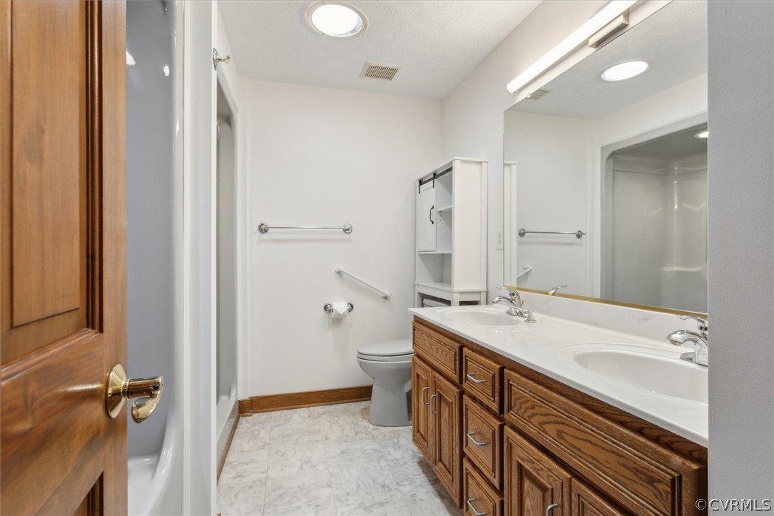 Bedroom Above the Garage offers this Large Full Bath with Two Showers, Dual Vanity, and New Lighting