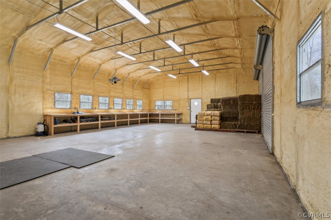 30 x 70 Metal Building - Consists of Workshop with 2 Tall Roll Doors, Spray Foam Insulated, 2 Horse Stalls (12 x 12), Kitchen with Sink, Refrigerator, and Cabinets for Storage