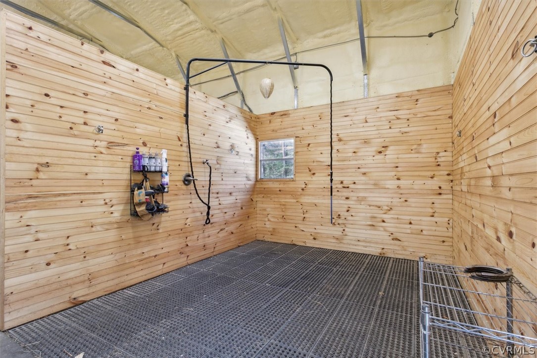 Wash stall for Horses in the 30 x 70 Metal Building, 2 Horse Stalls (12 x 12), Kitchen with Hot Water Heater, Refrigerator, and Cabinets for Storage, Tack Room, and Workshop