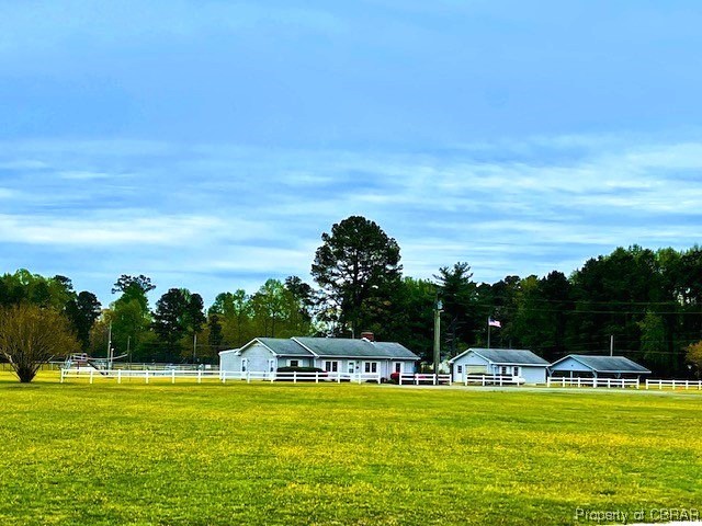 View of home's community featuring a yard