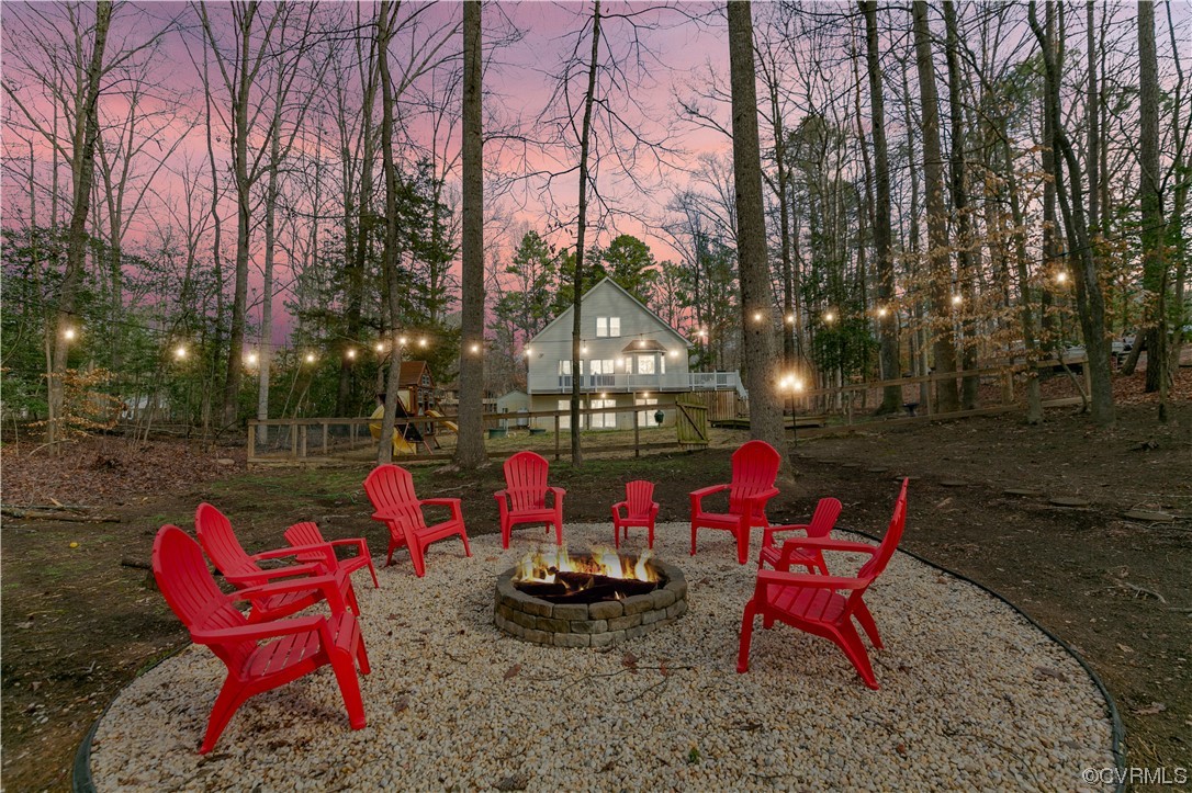 Yard at dusk with a fire pit