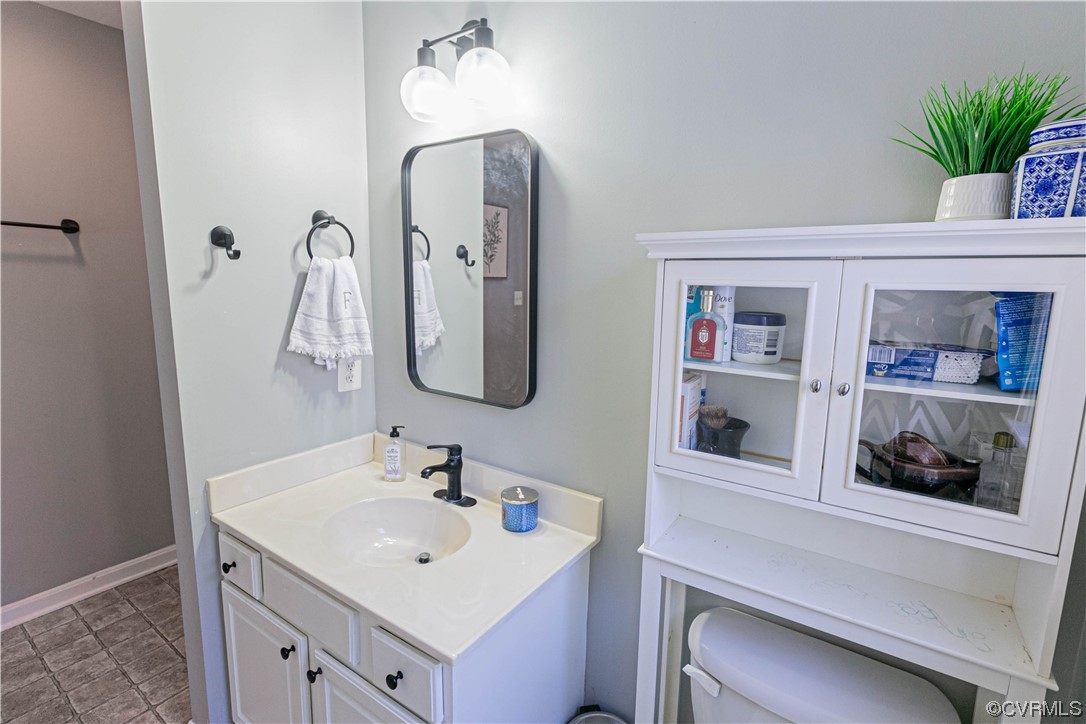 Primary Bathroom featuring vanity with extensive cabinet space