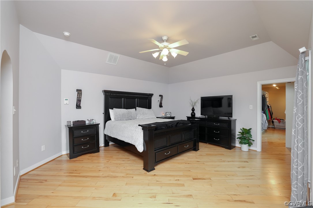 Primary bedroom on second floor - spacious, hardwoods, lake views, and private balcony