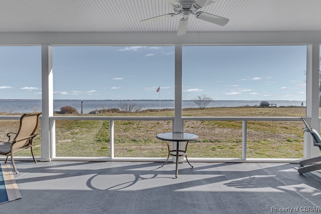 Screened Porch with a water view and ceiling fan