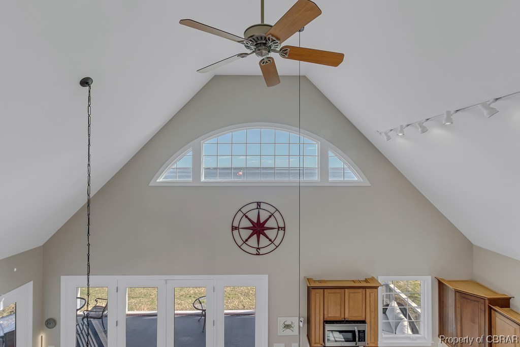 Details with rail lighting and ceiling fan