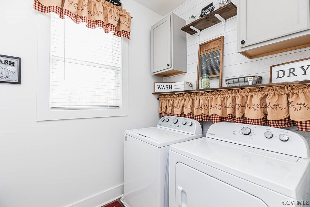 Laundry Room with quaint wooden wall & built-ins!