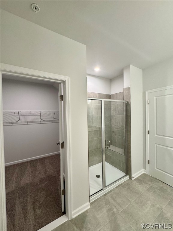 Bathroom featuring tile flooring and walk in shower