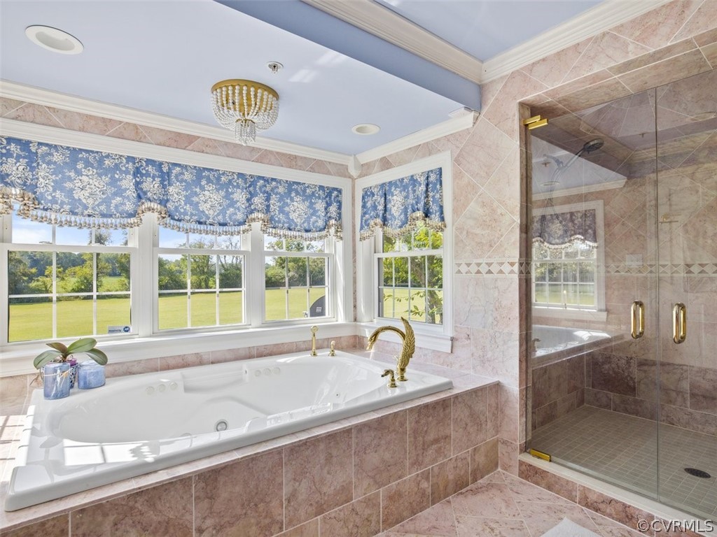 Primary Ensuite Featuring Large Tub And Tiled Shower. Separate Vanities And Drssing Room.