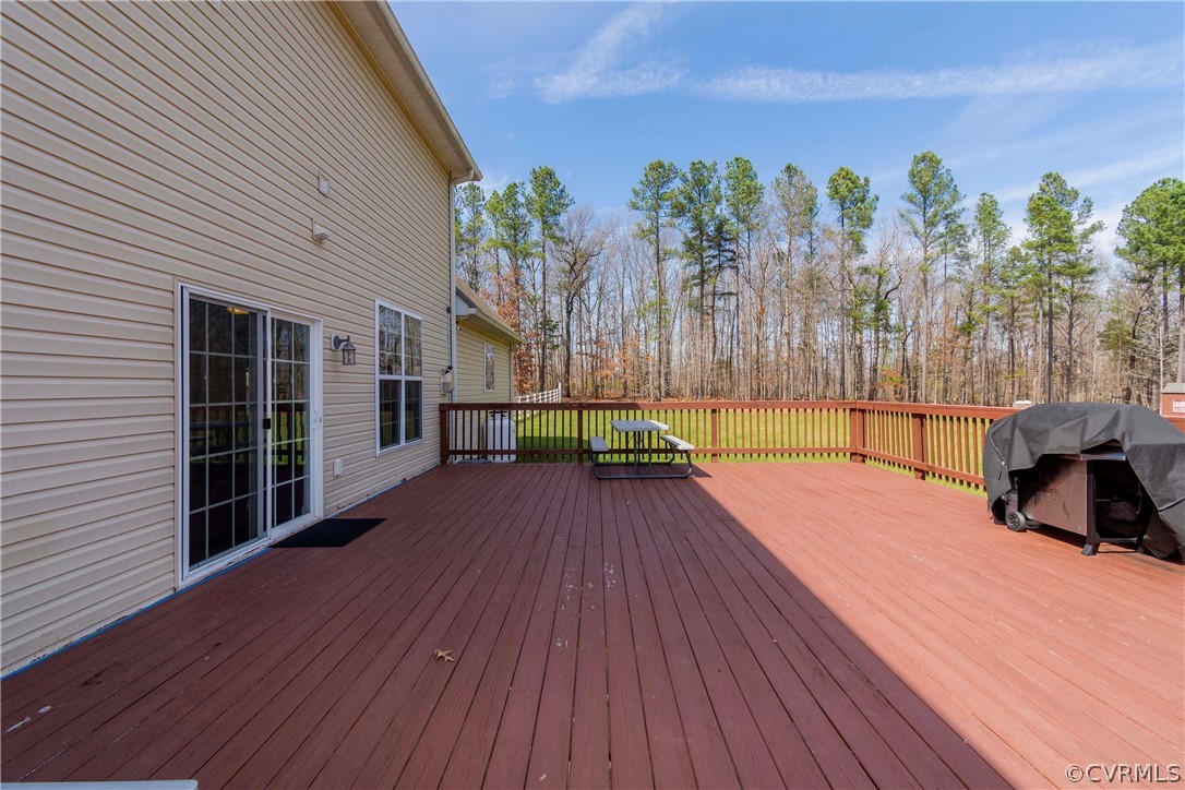 Wooden deck featuring grilling area