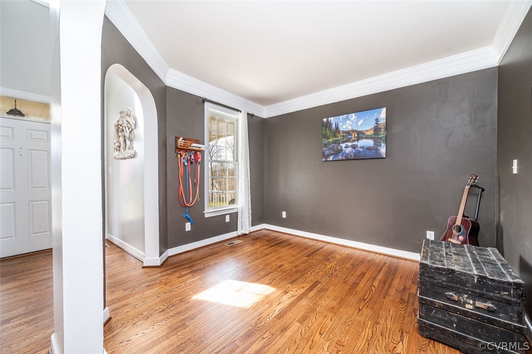 Entryway featuring light hardwood / wood-style floors and crown molding