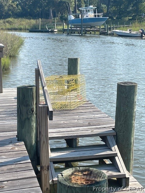 View of dock with a water view