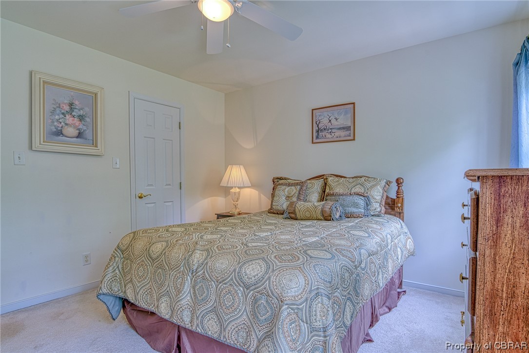 The third and exceptionally bright bedroom on the second level, overlooking the backyard and golf course.
