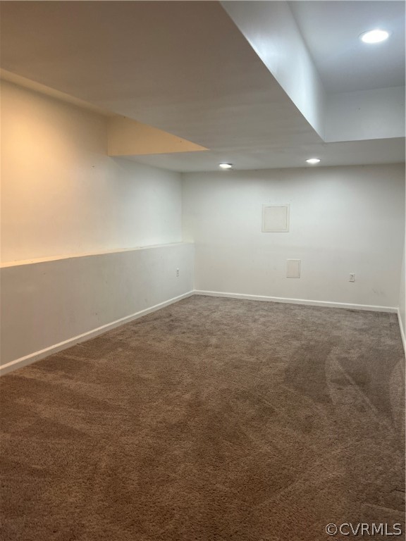 Basement featuring carpet flooring