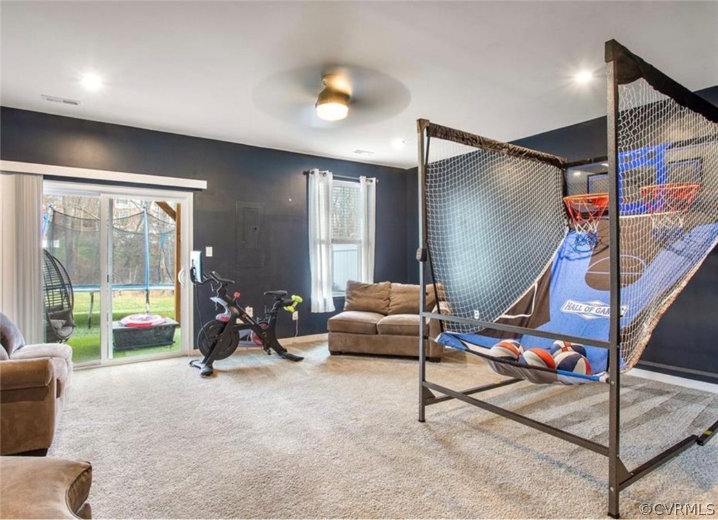 Workout room featuring carpet flooring and ceiling fan