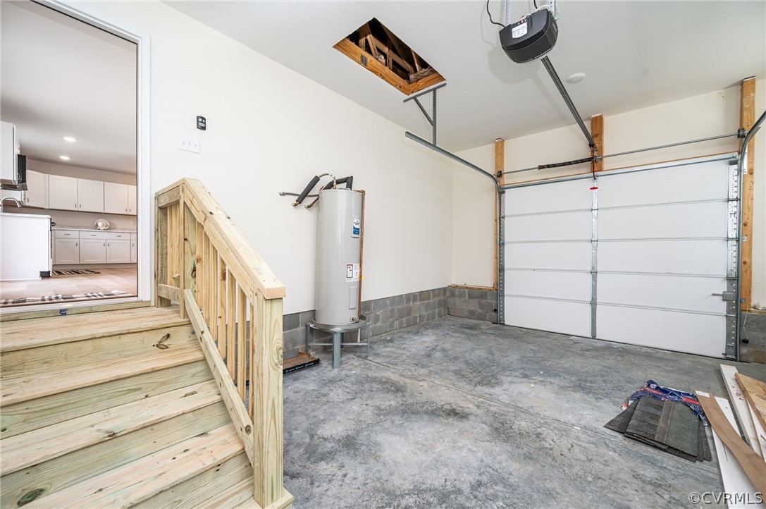 Garage with a garage door opener and electric water heater with direct entry to the Great Room