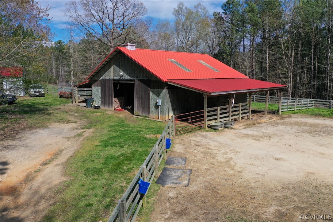 View of stable featuring an outdoor structure