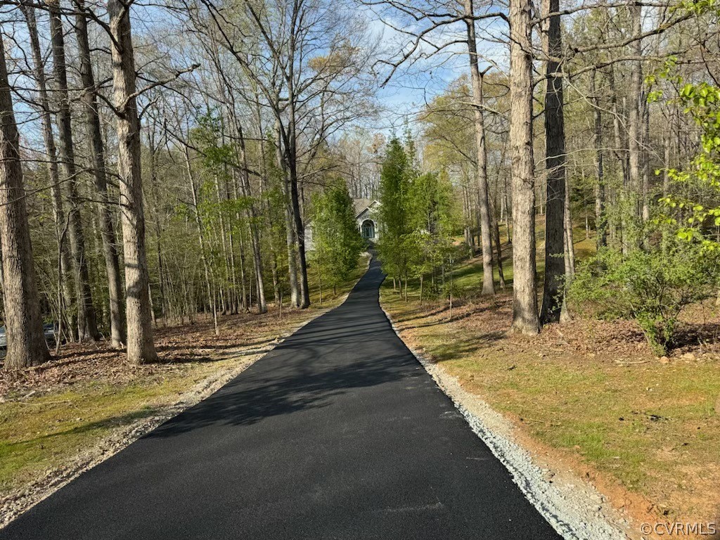 View of the long newley paved driveway leading to home