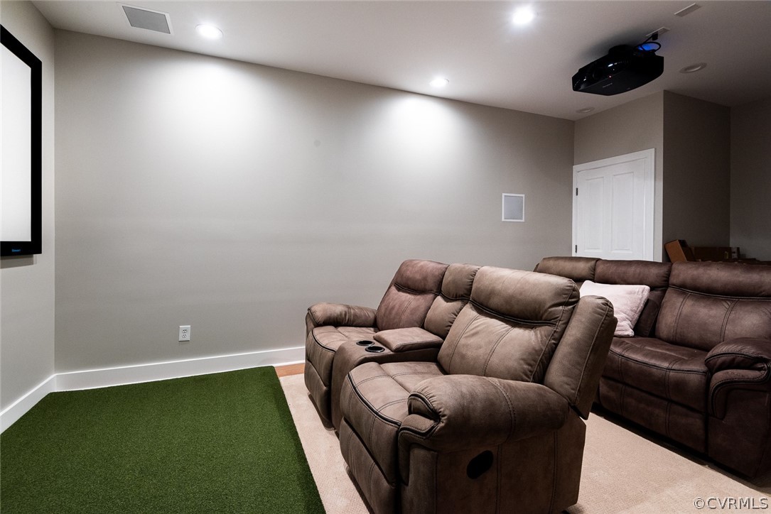 Basement home theater with golf simulator