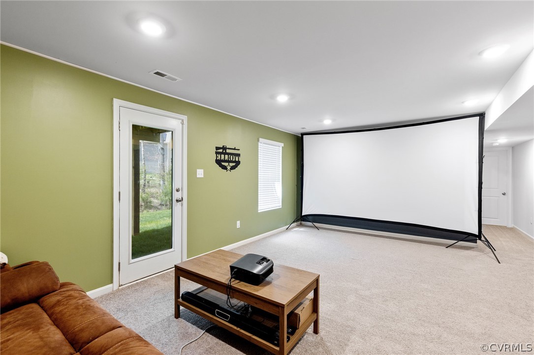 Home theater room walkout to backyard.