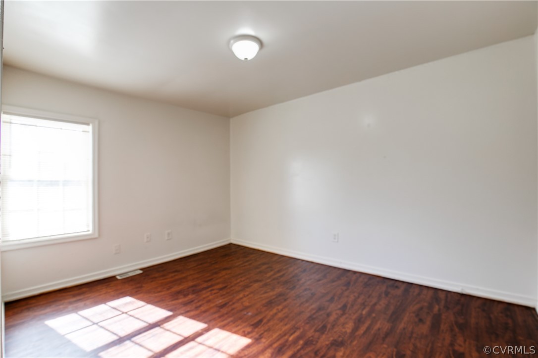 Spare room featuring hardwood / wood-style floors