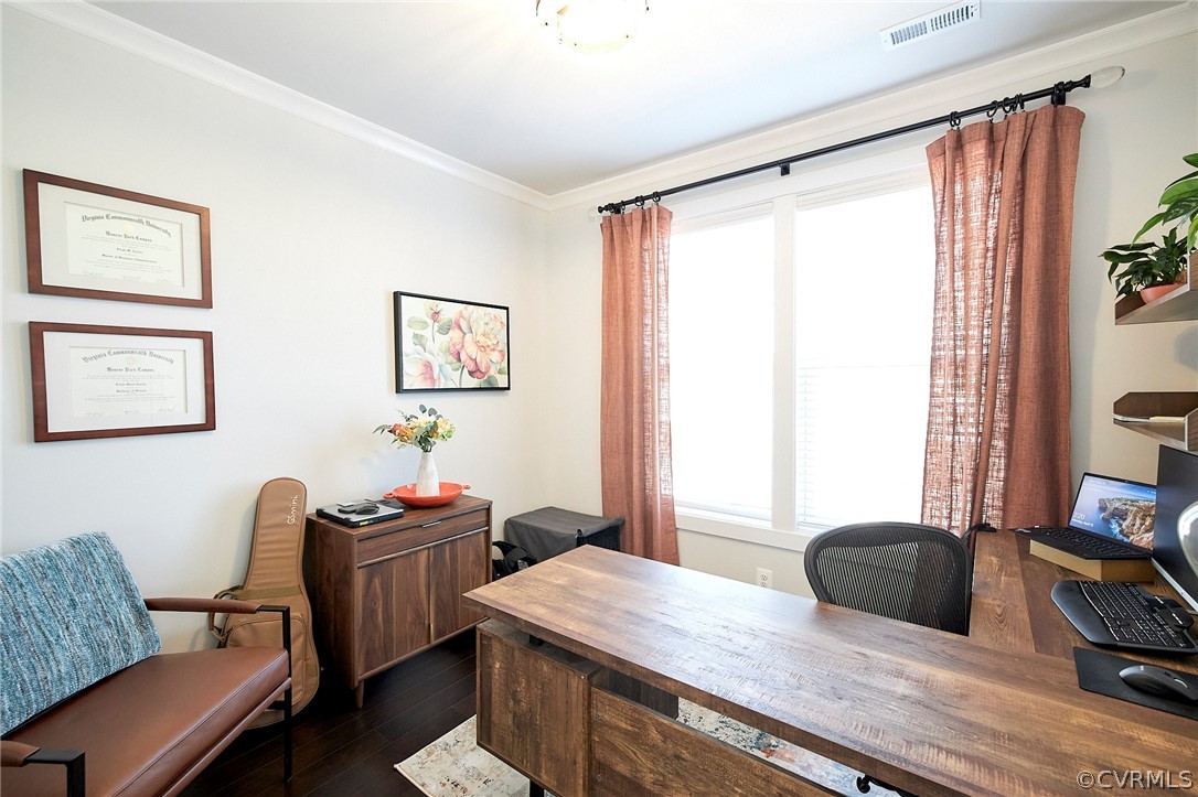 Office area with plenty of natural light, dark hardwood / wood-style flooring, and crown molding