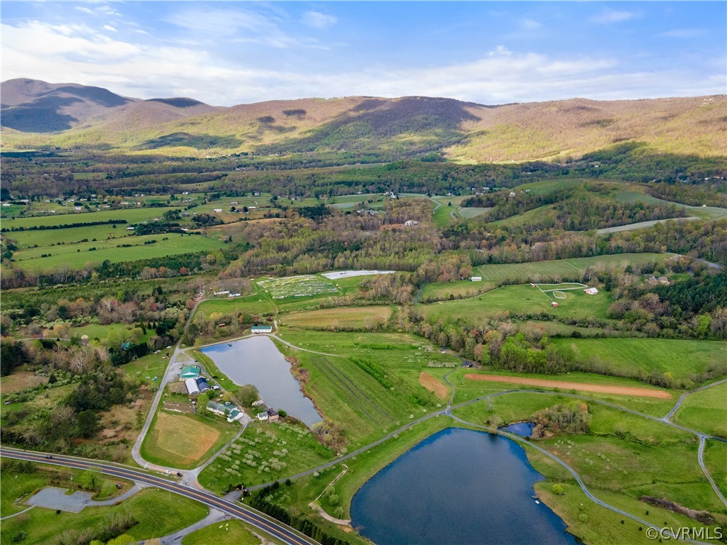 Drone / aerial view with a rural view and a water and mountain view