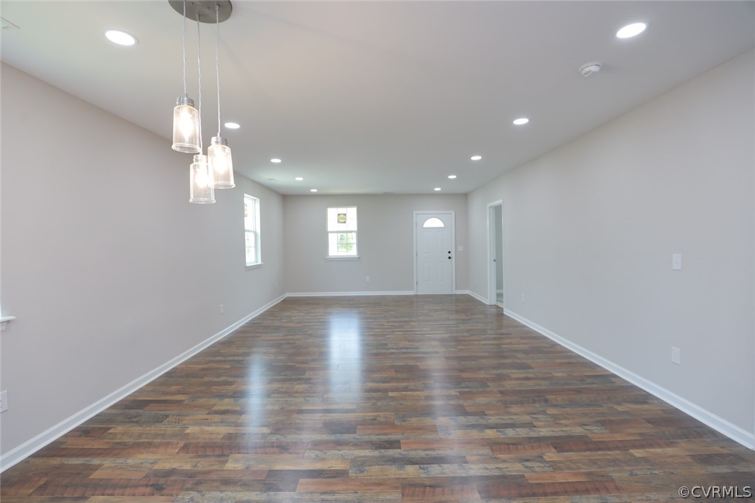 Spare room with dark hardwood / wood-style floors