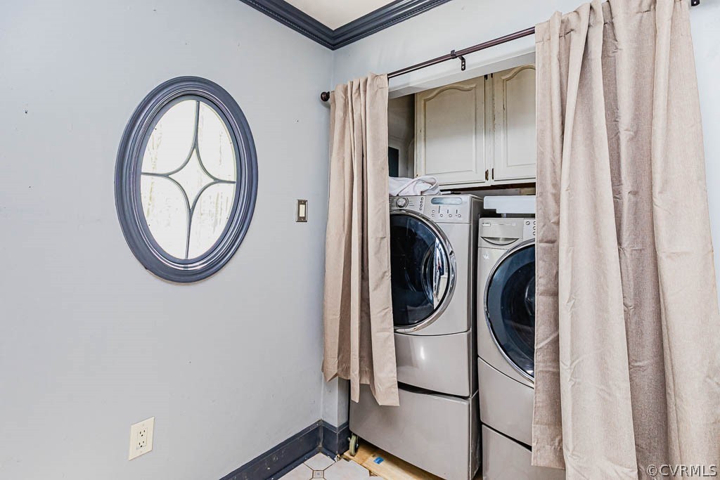 Laundry room with washer,dryer, and​​‌​​​​‌​​‌‌​‌‌​​​‌‌​‌​‌​‌​​​‌​​ cabinets