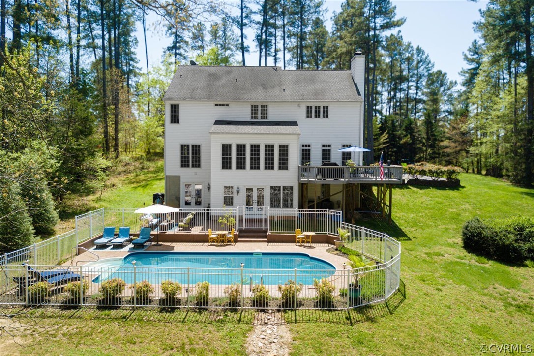 Upper deck accessed from the kitchen and a walk out basement to beautiful heated, saltwater pool and patio area for family fun and entertaining. Stamped concrete surround and patio, aluminum fence around the pool area.