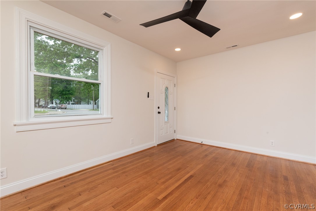 Spare room with ceiling fan and hardwood / wood-style flooring