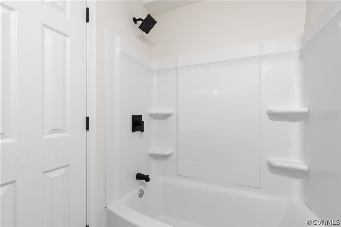 Bathroom featuring shower / bath combination
