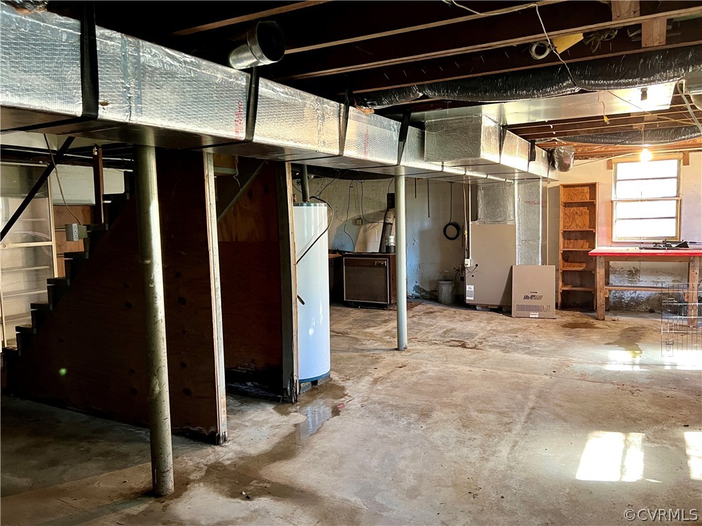 Basement featuring heating utilities and water heater