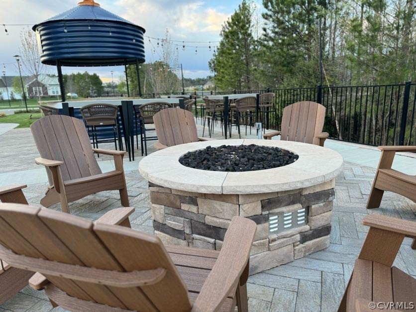 View of patio / terrace with an outdoor fire pit