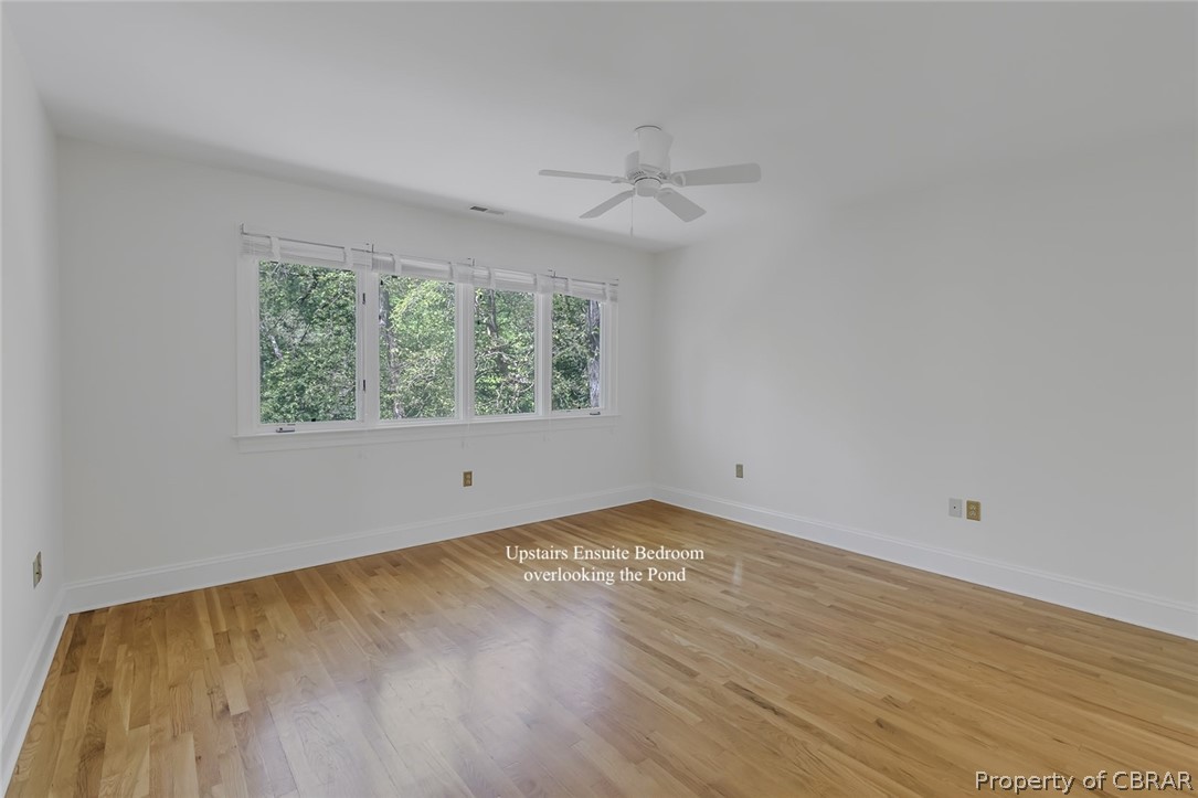 Unfurnished room with light hardwood / wood-style flooring and ceiling fan