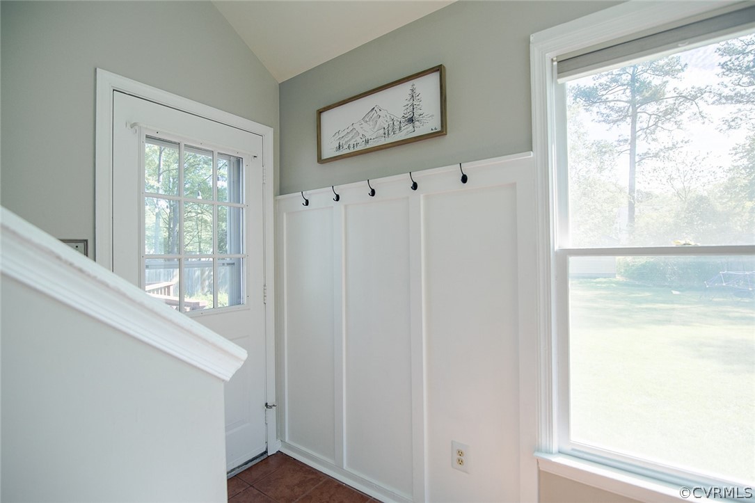 Rear exit to deck, coat hooks, stairwell to second floor