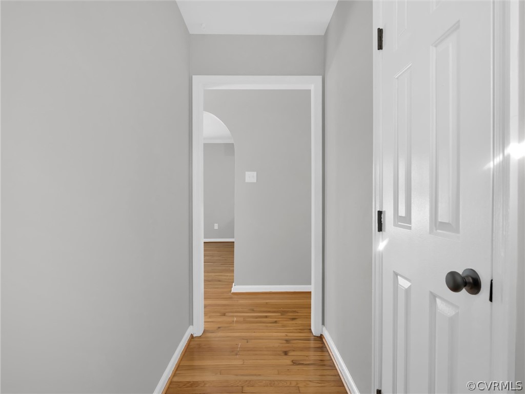 Hall with light hardwood / wood-style floors