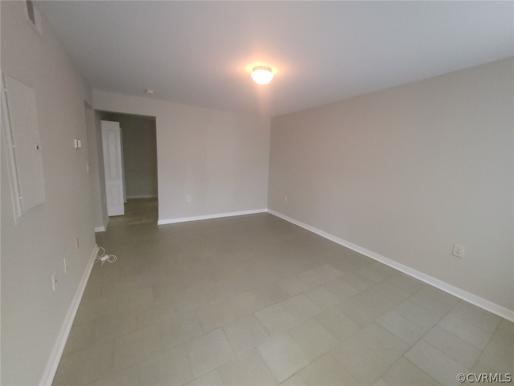 Unfurnished room featuring tile flooring