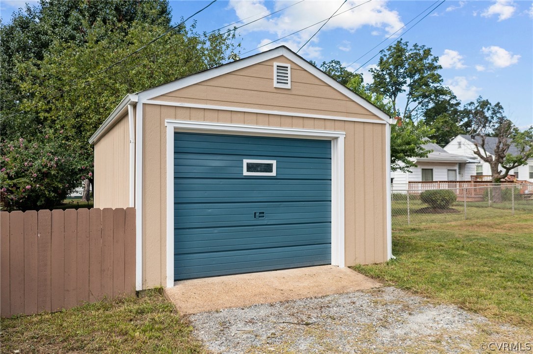 Garage featuring a yard
