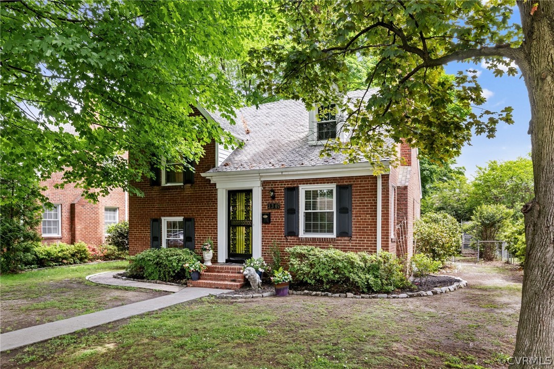 Welcome to the charming neighborhood of Edgewood in the historic Ginter Park area. This brick home with a slate roof offers so much flexibility for use of space.  The living room, complete with hardwood and a fireplace opens up to the dining room.  A few steps down take you to what is currently being used as a rec room but could have so many other uses as well. That space also takes you out to a beautiful patio and fenced-in back yard to enjoy.  The stairway has an abundance of charm as well leading up to spacious bedrooms, full bath and a few steps up lead you to the primary bedroom.  This location is also convenient to shopping, restaurants, a park, interstate access and much more.
