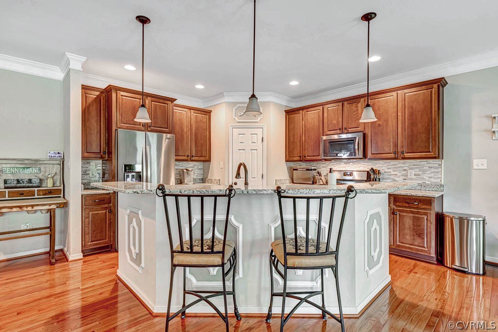Eat-in Kitchen with maple cabinets & pendant lighting