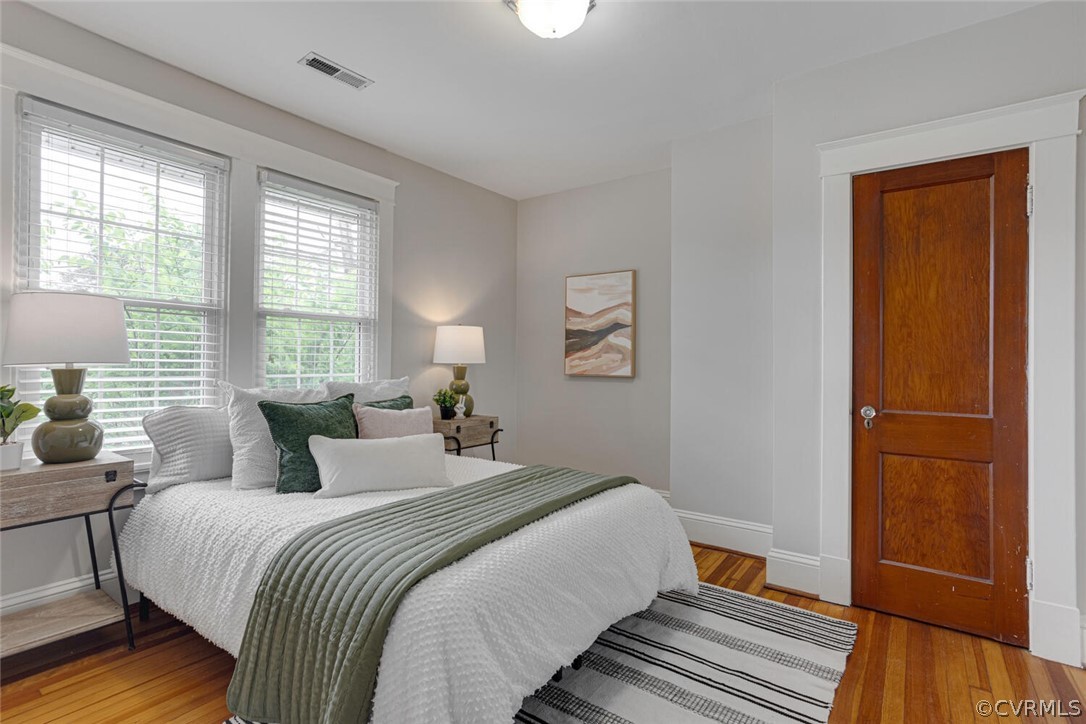 Bedroom with light hardwood / wood-style flooring