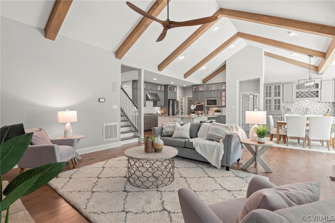 Featuring a completely open concept layout that feels larger than life due to the vaulted ceilings throughout main living area. Everywhere you look you will see designer selections and thoughtful upgrades.