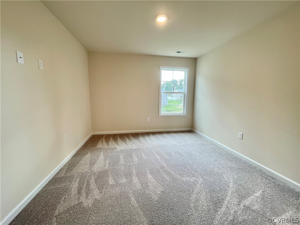 Empty room featuring carpet